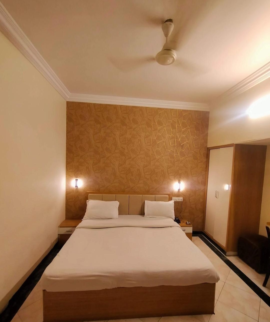 Spacious hotel room with a double bed
